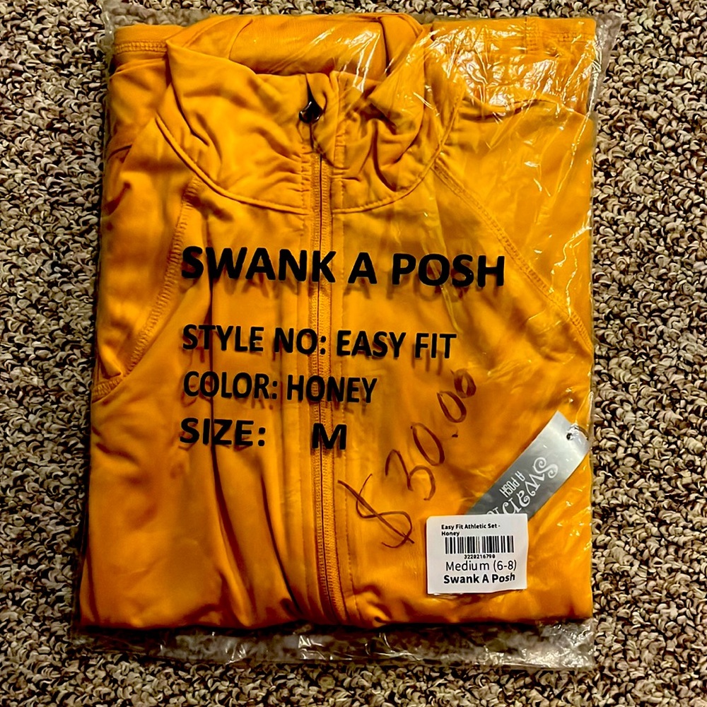 Brand New, Never worn. 2 piece yellow track suit